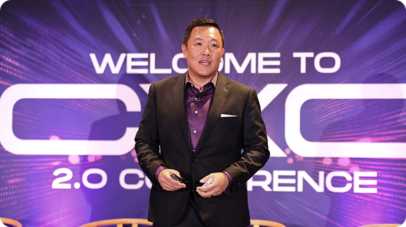 Trung Q. Pham speaking on stage